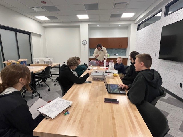 Teens playing a game of Dungeons and Dragons inside the library