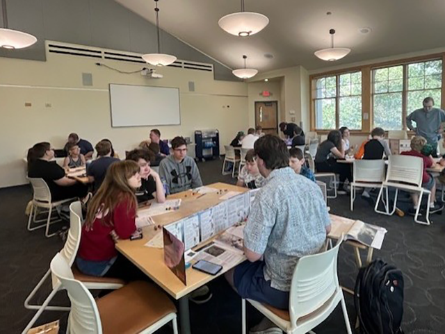 Teens playing a game of Dungeons and Dragons inside the library