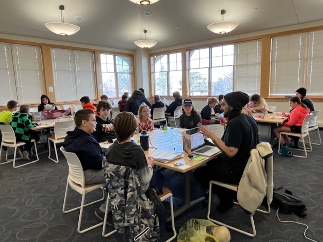 Teens playing a game of Dungeons and Dragons inside the library