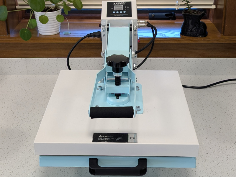 A white Vevor Heat Press machine on a white countertop