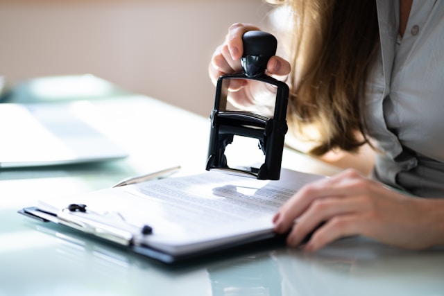 Woman stamping a document