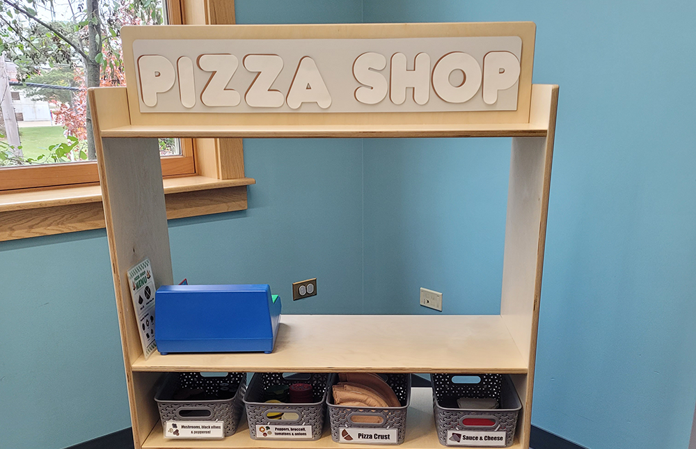 Play station with the words "Pizza Shop" on top