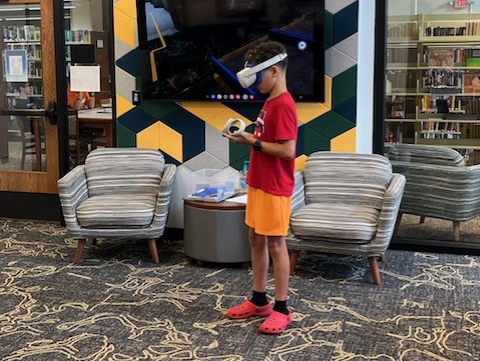 Boy playing with VR headset