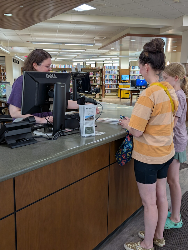 People checking out at circulation desk