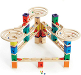 85 colorful wood pieces (including a seesaw, straight away rails, and funnels), 50 marbles, and an instruction book.