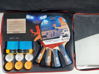 Ping Pong set including four paddles, six ping pong balls, and a carrier bag.
