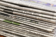 Stack of print newspapers